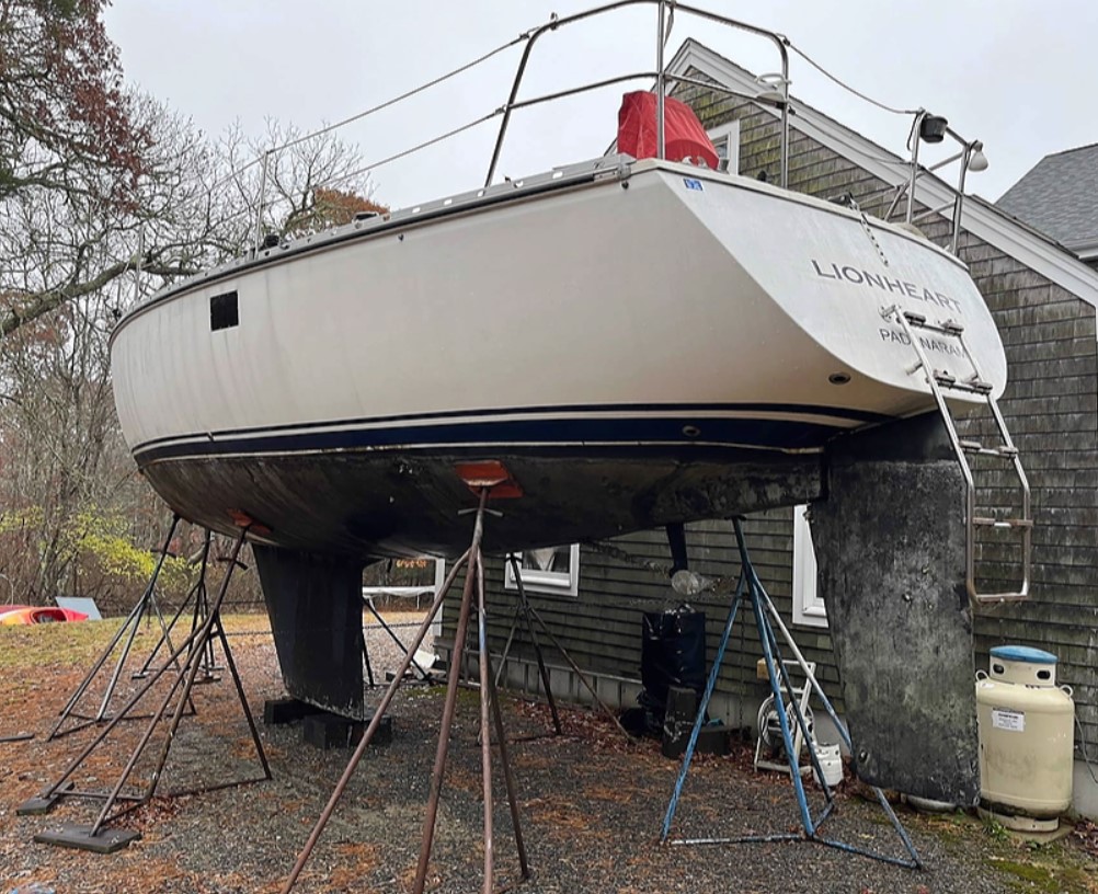 Sailboat Removal crew handling mast rigging and vessel disposal