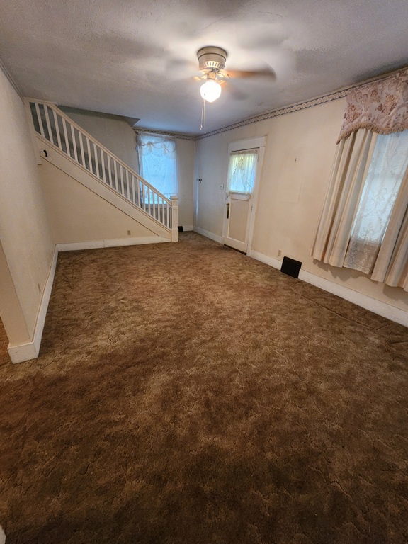 Old Carpet in empty Room with stairs